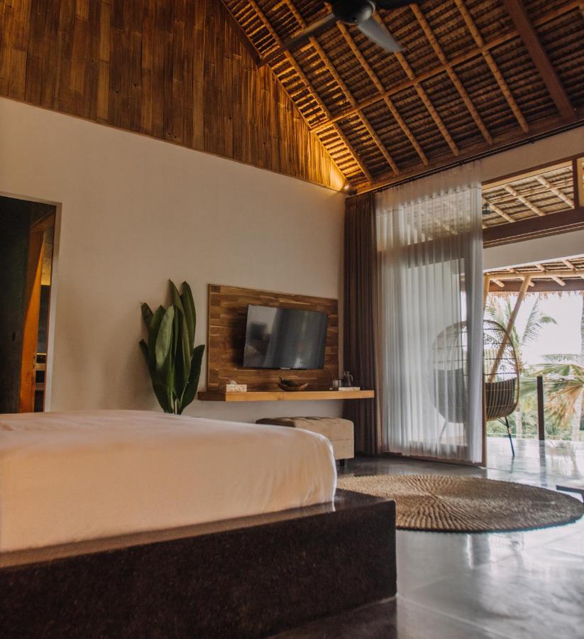 Neano Escape Ξενοδοχείο Manggis Εξωτερικό φωτογραφία A bedroom at the resort